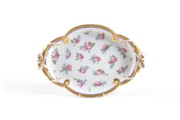 A Serves porcelain quatrefoil tray, circa 1775, painted with pink roses and blue forget-me-nots,