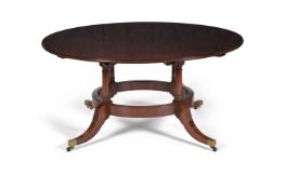 A mahogany circular concentric extending dining table, in 19th century style, second half 20th