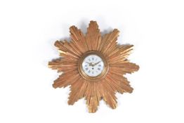 A giltwood wall clock, 19th Century, in the form of the sun in splendour, the dial signed Denizarh