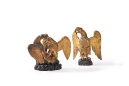 A carved and giltwood model of a spreadeagle, 19th century, head to dexter, standing on a rockwork