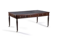 A Regency style mahogany writing table, the moulded rounded rectangular tooled leather inset top