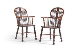 A harlequin set of eight Windsor armchairs, various dates 19th century, comprising a pair of