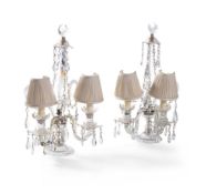 A pair of cut-glass two-branch candelabra, 19th century, surmounted with crescent moons and with