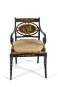 A Regency ebonised, painted, and parcel gilt armchair, circa 1815, the oval tablet back painted en