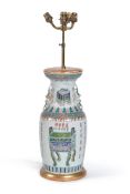 A Chinese ‘Famille Verte’ vase, circa 1880, decorated with precious vessels and calligraphy, the