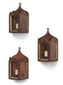 A set of three painted wood and glazed wall lanterns in Gothic manner, modern, 35cm high, 23cm wide
