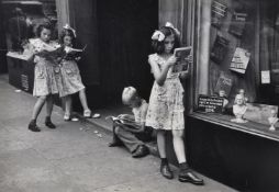 Ruth Orkin (American 1921-1985), Comic book readers, Greenwich Village, NYC