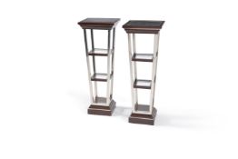 A pair of square tapered pedestals