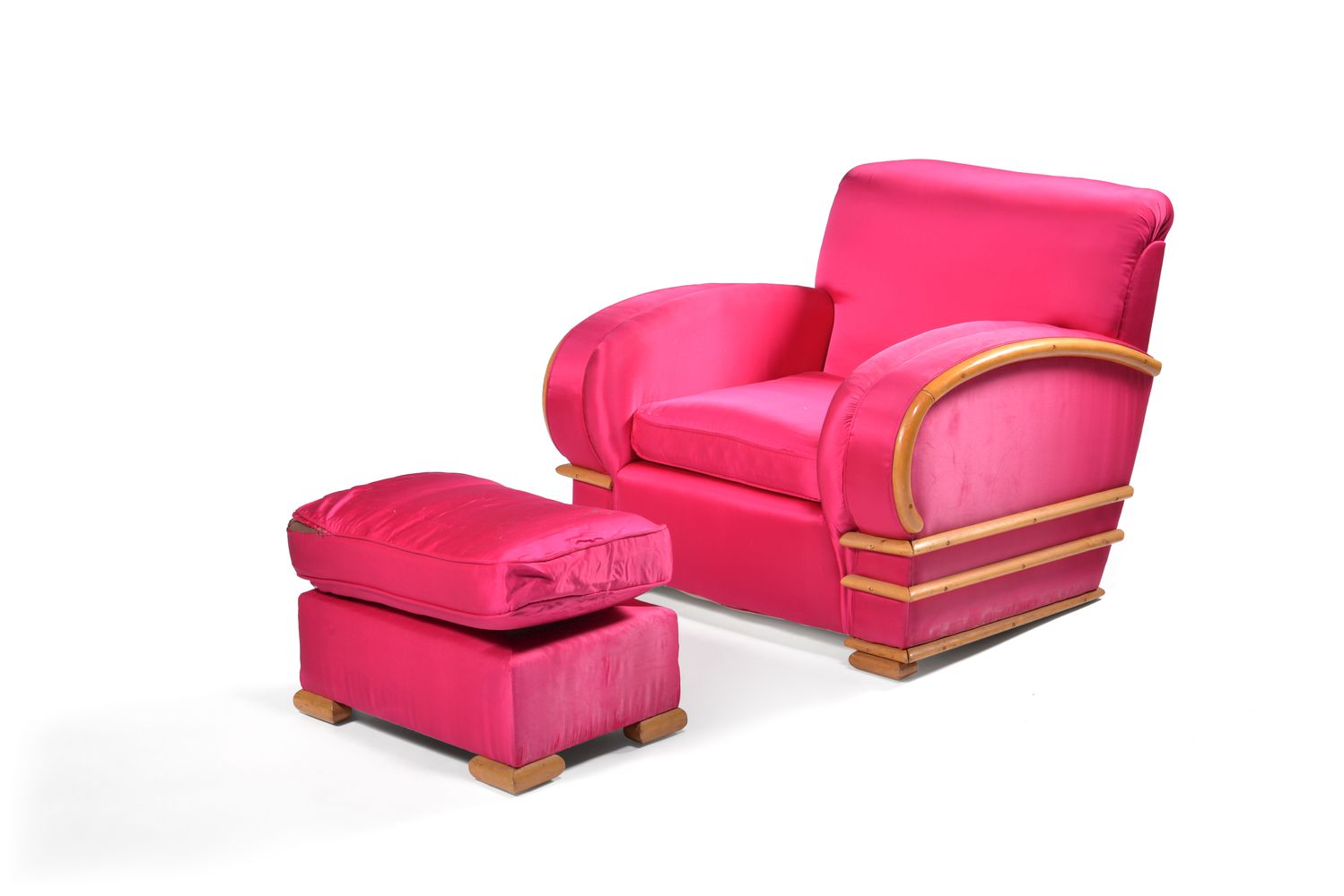 An Art Deco lounge armchair and matching footstool