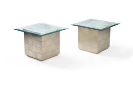 A pair of modern silvered cube occasional tables with white marble tops