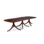 A mahogany triple pillar dining table in Regency style,