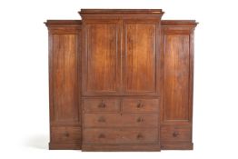 A George IV mahogany breakfront wardrobe