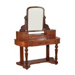 A Victorian mahogany dressing table with arched toilet mirror and five small drawers