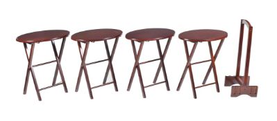 The Bombay Company; a modern Malaysian hardwood set of four folding oval occasional tables and stand