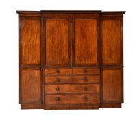 A George IV mahogany breakfront wardrobe