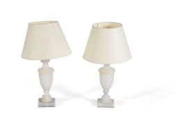 A pair of Italian carved alabaster table lamps in 18th century taste