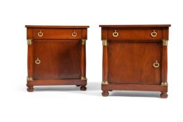 A pair of mahogany and gilt metal mounted bedside tables in Empire style