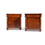 A pair of mahogany and gilt metal mounted bedside tables in Empire style