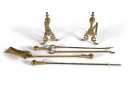 A set of late Victorian brass fire tools loosely in Rococo taste