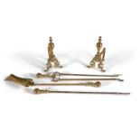 A set of late Victorian brass fire tools loosely in Rococo taste