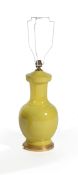 A yellow porcelain vase table lamp