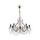 A Continental gilt metal and moulded glass eight light chandelier