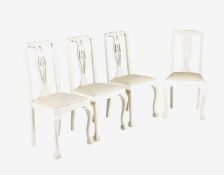A set of four white painted chairs
