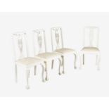 A set of four white painted chairs