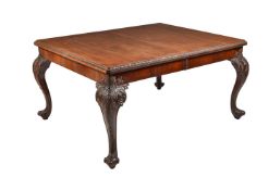 A mahogany extending dining table