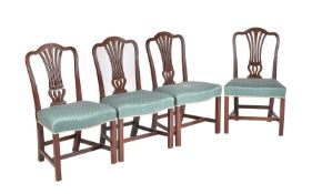 A set of four George III mahogany dining chairs