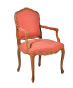 A modern carved beechwood framed armchair in the French 18th century manner