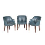 A set of three mahogany and blue upholstered library armchairs