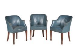 A set of three mahogany and blue upholstered library armchairs