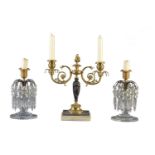 A pair of Regency cut glass and gilt and patinated bronze lustre candlesticks
