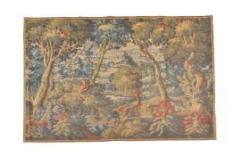 A woven tapestry panel in the manner of 18th century verdure examples