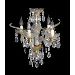 A Murano moulded and cut clear glass four light chandelier