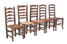 A harlequin set of thirteen beech ladder back dining chairs