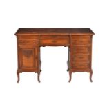 A Continental walnut and figured walnut kneehole desk