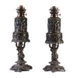 A pair of lacquered spelter table oil lamps in Historicist taste