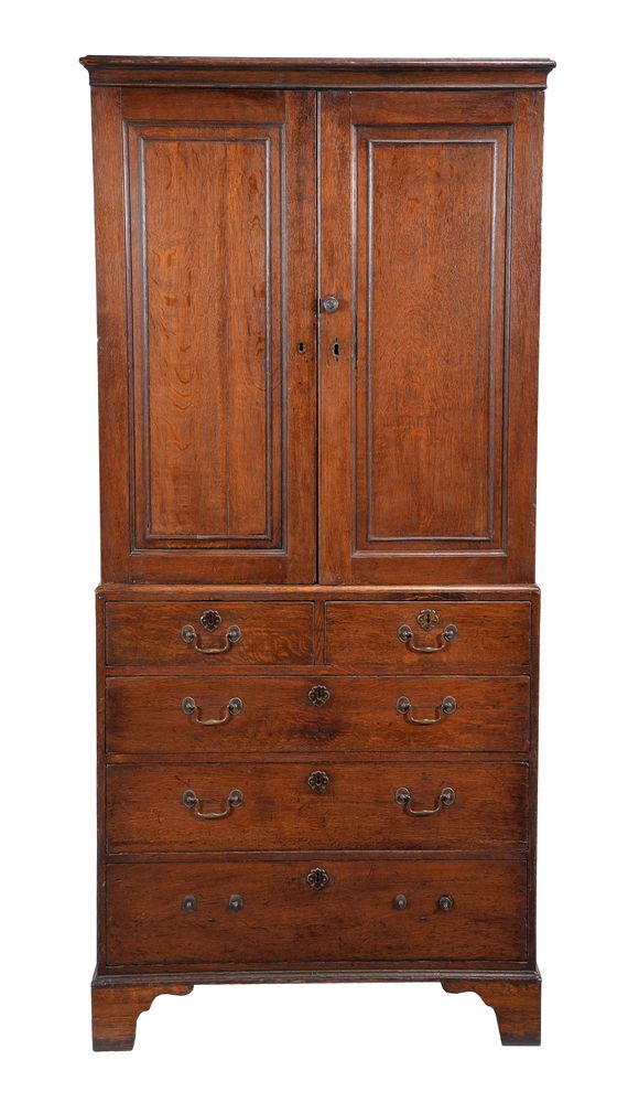 A George III oak press cupboard on chest