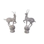 A pair of iron finials modelled as stags