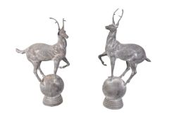 A pair of iron finials modelled as stags