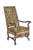 An ebonised and parcel gilt high back armchair