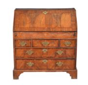 A Queen Anne walnut and mahogany banded bureau