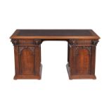 A carved oak twin pedestal desk in 17th century style