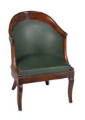 A French mahogany and upholstered bergere armchair in Empire style