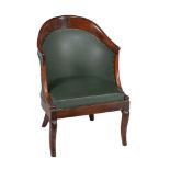 A French mahogany and upholstered bergere armchair in Empire style