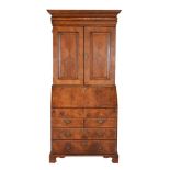 A George II walnut bureau bookcase