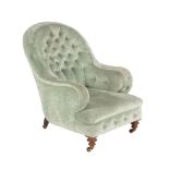 A Victorian walnut and upholstered armchair