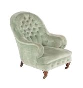 A Victorian walnut and upholstered armchair